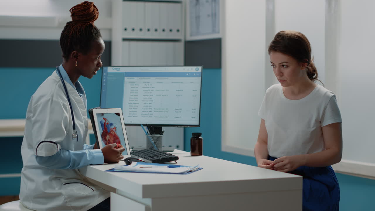 Doctor explaining diagnosis to patient during medical consultation