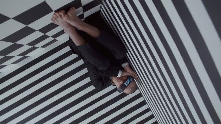 Man in a Geometric Illusion