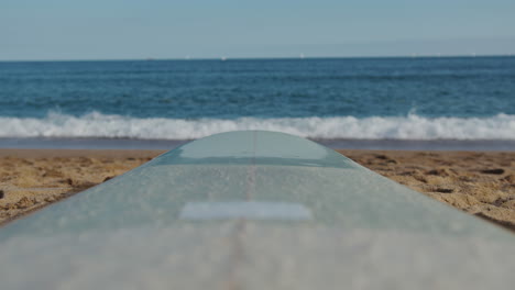 surfer man walking to the beach at sunset preparing for surfing training and search for waves in barcelona, spain, water, ocean exercise in sea with board, athletic male holiday or travel in vacation