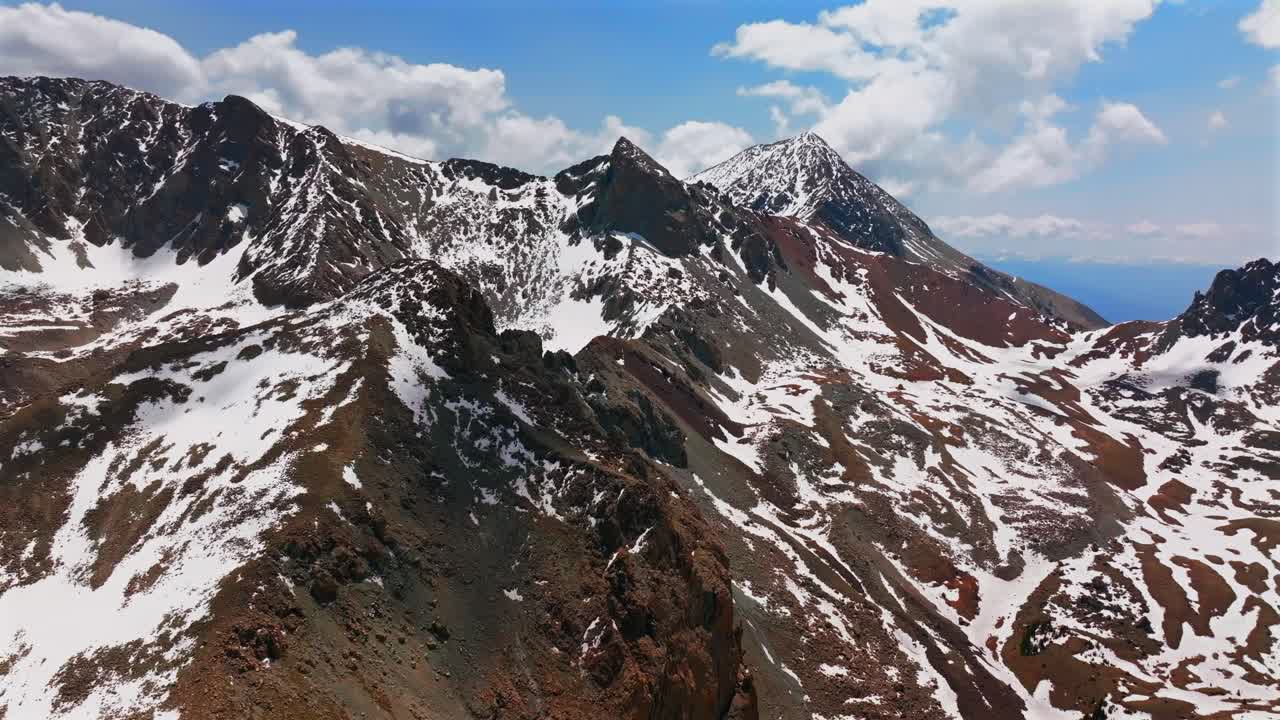 Mt Mount Lindsey Spring summer snow fields melting morning blue sky clouds Sangre De Cristo Range aerial drone Colorado high Rocky Mountains summit Sierra Blanca Massif Fort Garland circle right up