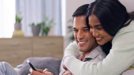 Phone,-relax-and-hug-with-couple-in-living-room