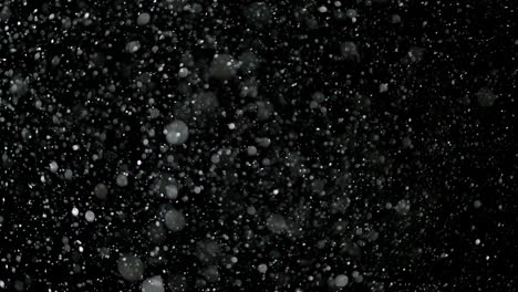 slow motion snow on black background