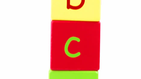 panorama of colorful alphabet toy blocks in a tower