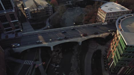 aerial view of a city bridge at sunset
