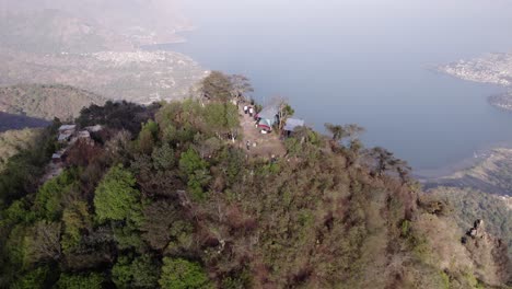 tourists explore the mayan face drone dolly to lake atitlan, solola, guatemala