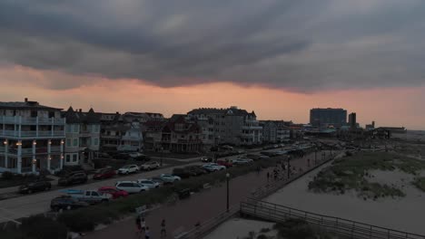 beautiful sunset at ocean grove boardwalk , editorial