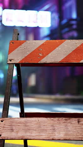 weathered barricade at night in a city street