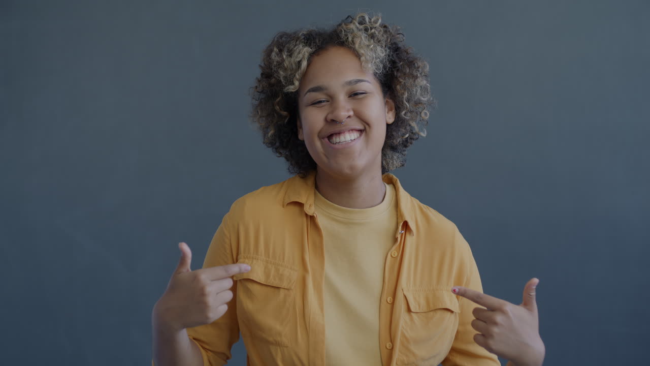 Smiling Woman in Yellow Shirt