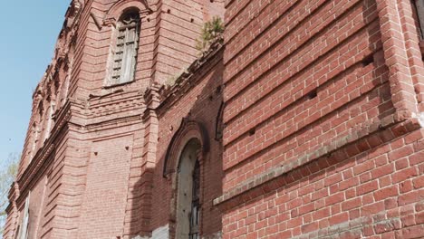 ruined red brick church building