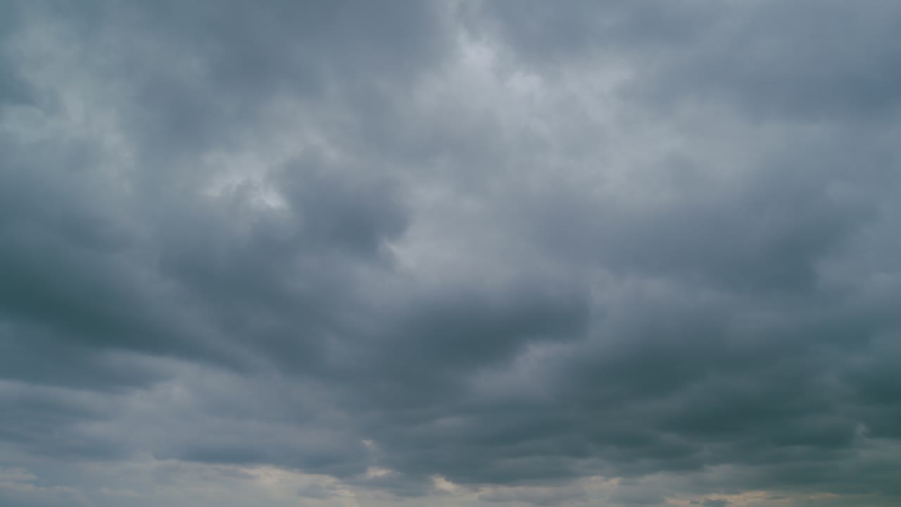 Storm clouds dramatic shadowy sky background. Grey storm clouds. Time lapse.
