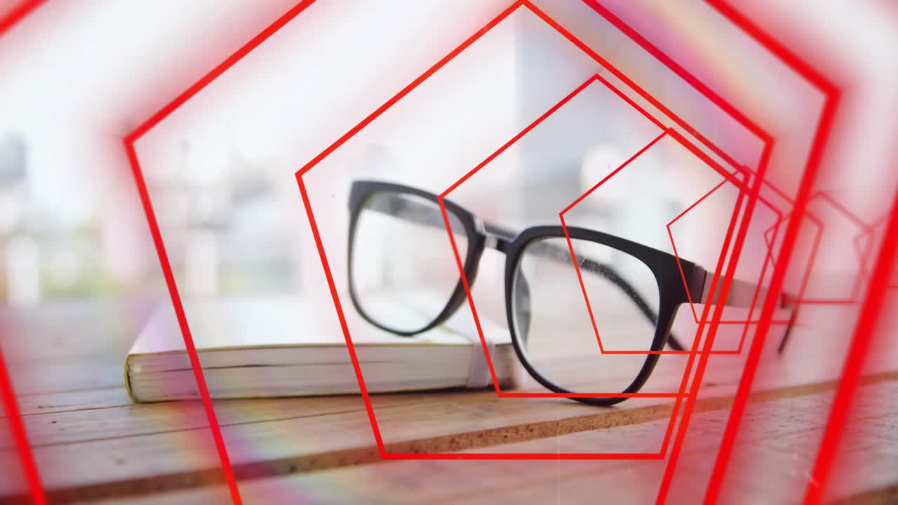 On play red pentagon outlines pulsing and tunneling over black glasses on book to draw focus