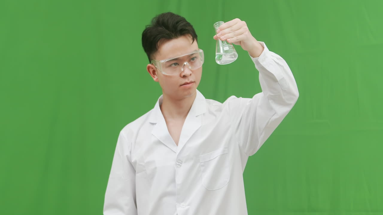 Scientist in Lab Coat Examining a Flask
