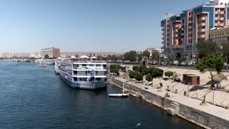 white cruise liner docked in aswan ready to sail down the nile in egypt