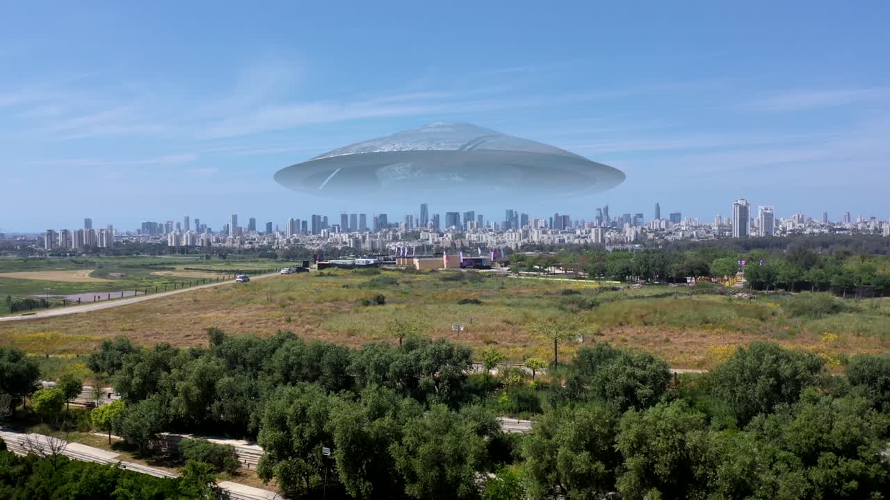 Massive Flying saucer hovering over large city Aerial view