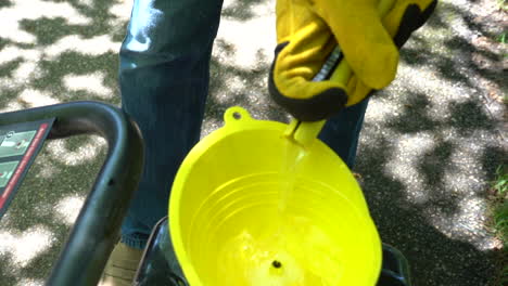 yellow funnel pour pressure washing preparation