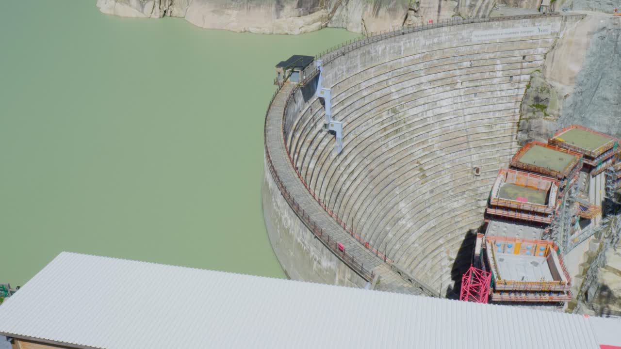 Reservoir with dam wall under construction in Switzerland