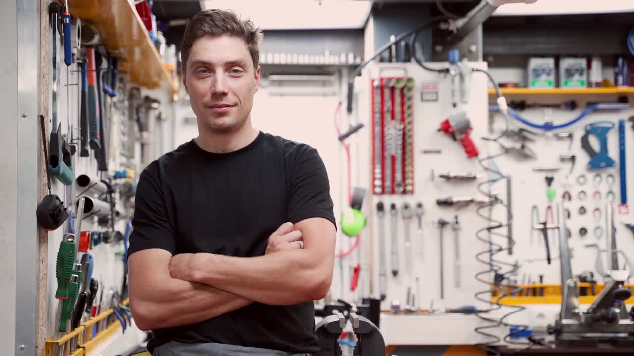 Man in bicycle repair workshop