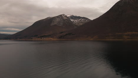 tranquil waters of nordfjord with scenic mountains in background in norway