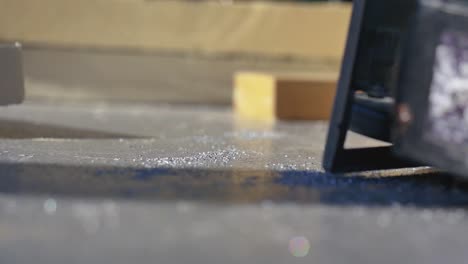 metal shavings blowing in the wind from a construction worker cutting metal