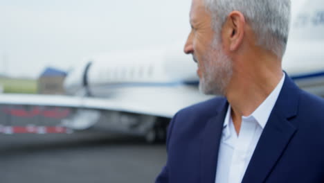 businessman buttoning his shirt sleeves on a runaway 4k