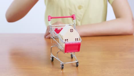 a playful representation of buying a house highlighting the whimsical side of real estate