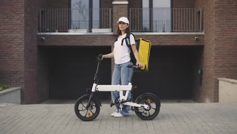 woman delivery person with e-bike