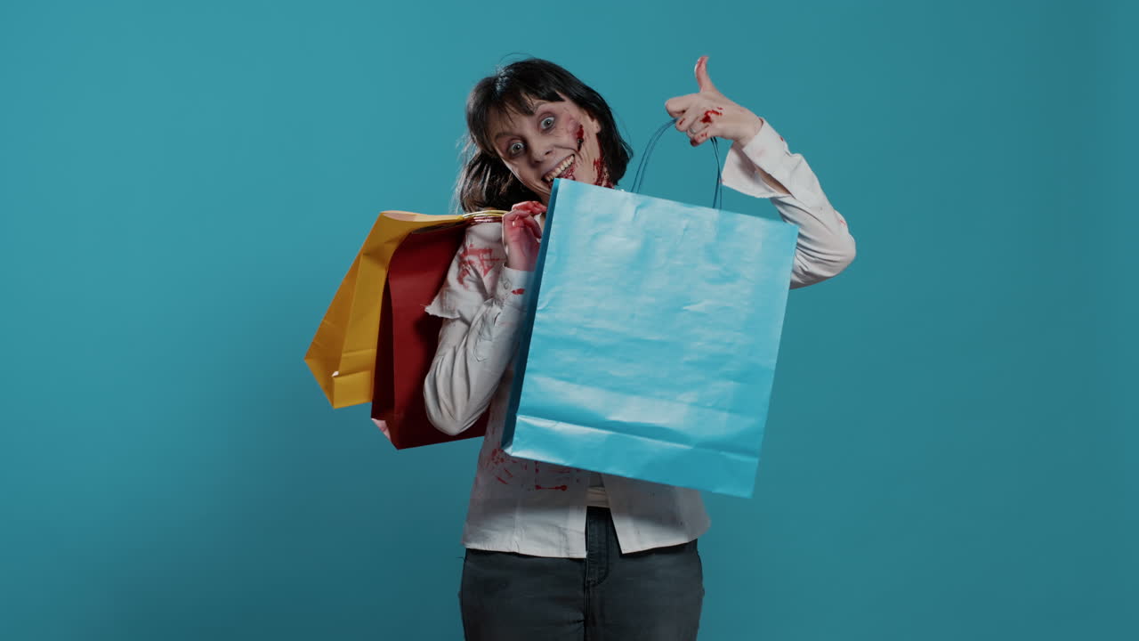 Sinister frightening zombie with colorful shopping bags from mall on blue background