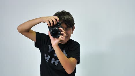 a child playing with a camera and taking photos