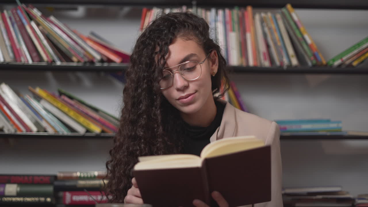 Young Woman Reading in a Cozy Library Cafe