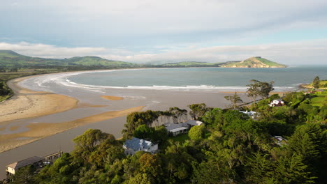 waikouaiti river flows to pacific ocean in karitane town, south island, new zealand