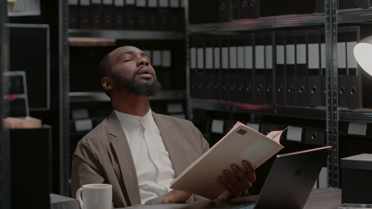 Man examining files in an archive room | Premium Stock Video Footage