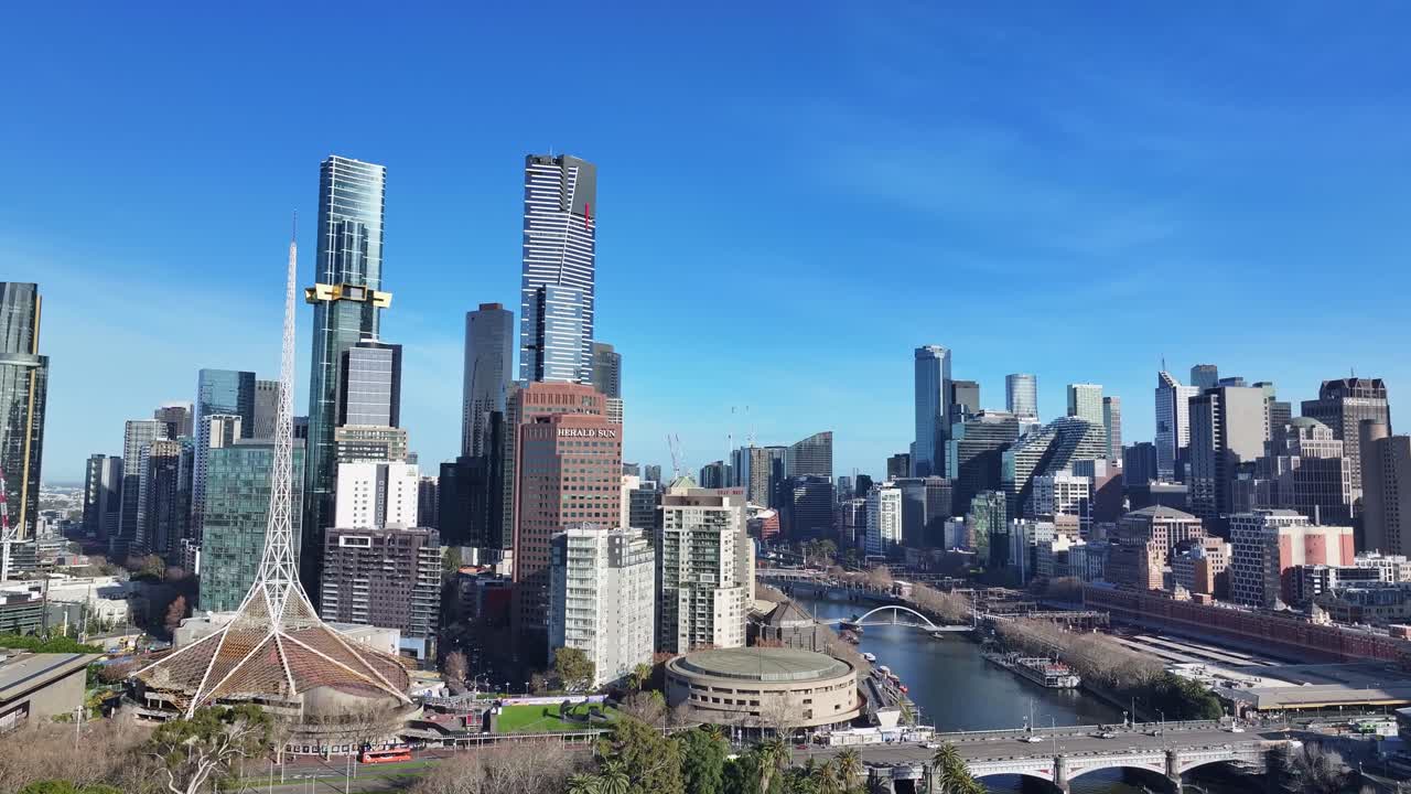 Aerial approaching the Melbourne Arts Centre and the CBD high rise of Melbourne