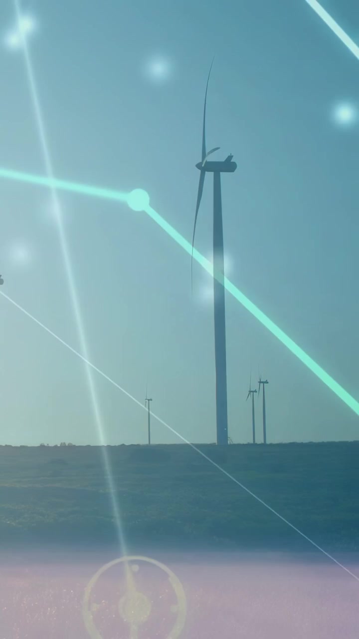 Video verticale: Bagliore del sole che attiva una sovrapposizione HUD mentre una turbina eolica ruota, mostrando la produzione di energia