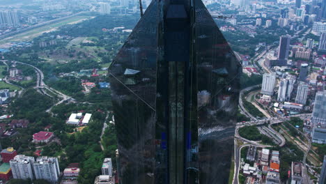 aerial tilt shot in front of the merdeka 118 tower, in kuala lumpur, malaysia