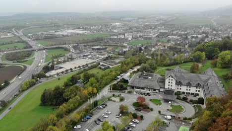 sideways aerial cinematic drone shot of highway traffic in egerkingen, switzerland