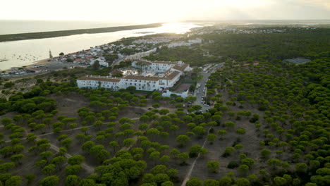 aerial shot of luxury garden playanatural hotel in el rompido during sunset in background,spain