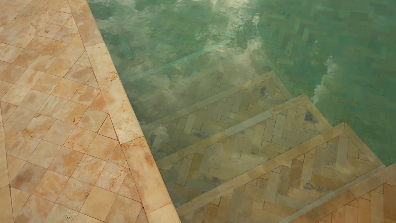 Tranquil pool with cloudy sky reflection in Marrakesh, Morocco