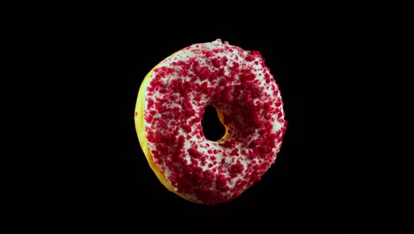donuts voladores de color rosa con salpicaduras.