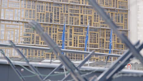 european flags at europa building against barbed wire fence to protect the area from riots and violence in brussels, belgium