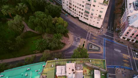 Top-view-of-an-intersection-and-the-rear-entrance-of-the-Santa-Lucia-hill-with-a-ship-style-building-in-Santiago-Chile