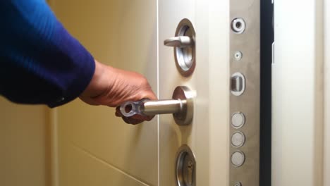 person opening a door