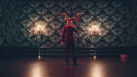 elegant devil dressed in a striking red suit and sporting horns is taking a selfie with a smartphone, surrounded by a vintage room softly illuminated by candelabras