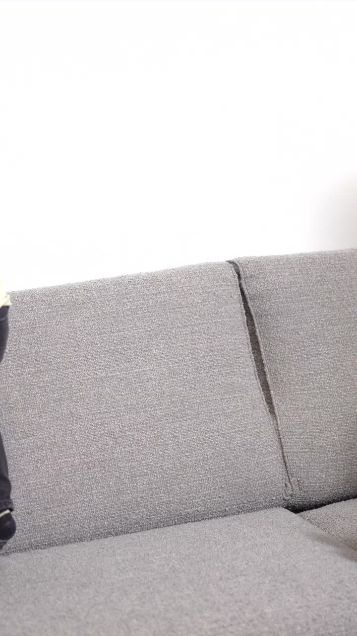 A heartwarming moment of a black family embracing on the couch