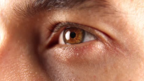 focus on the eye of a caucasian man looking away