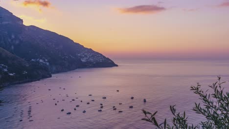 Time-lapse-of-drifting-yachts-anchored-in-the-harbor-are-greeted-by-a-dramatic-sunrise