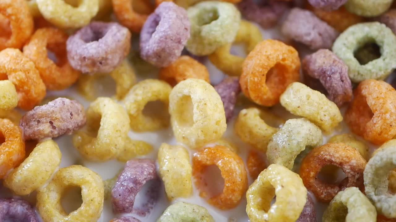Close-up of colorful loop cereal in milk