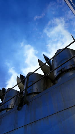smoke from grain elevators. modern plant for drying seeds. white vapor released from industrial pipes of the granary. vertical video