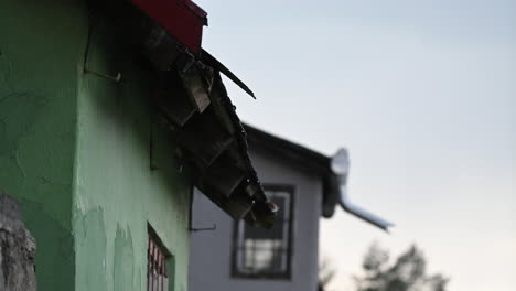 rain pouring down on roof of a house