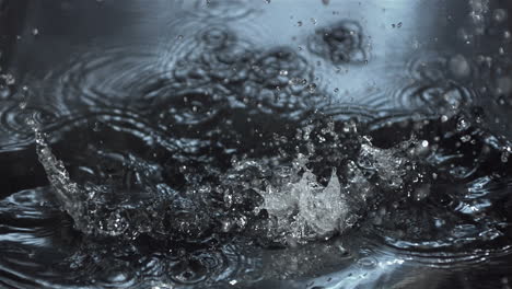 glass bottle falling into water