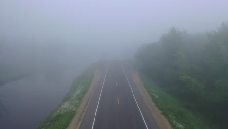 misty bridge over river